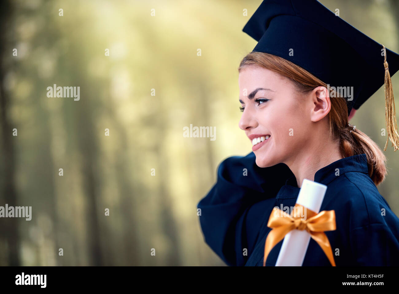 Graduation: Student Standing With Diploma Stock Photo - Alamy