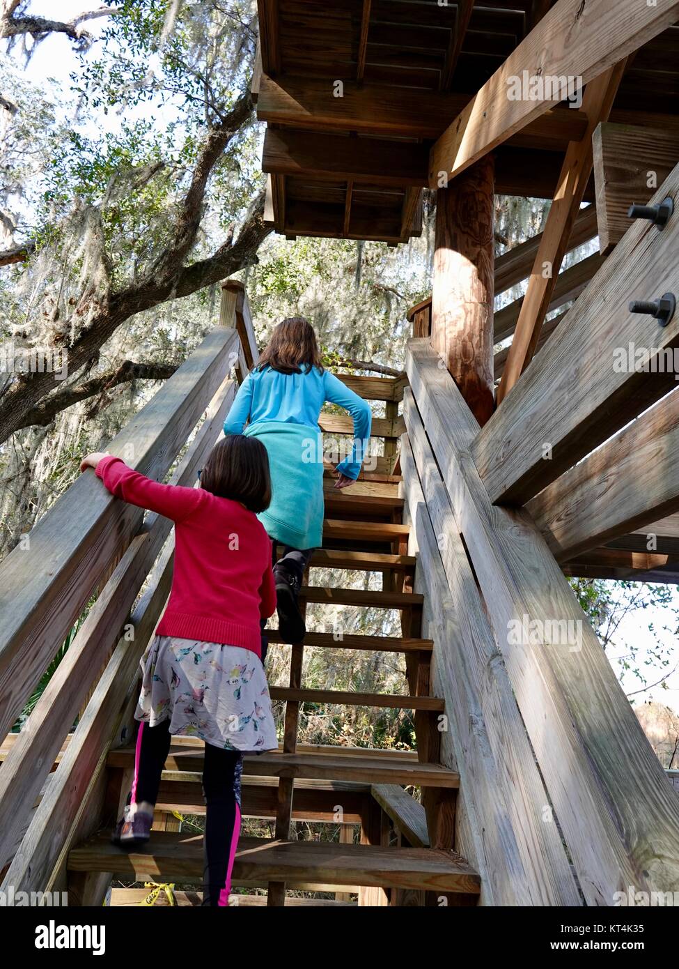 Two girls climbing steps to observation tower Stock Photo Alamy