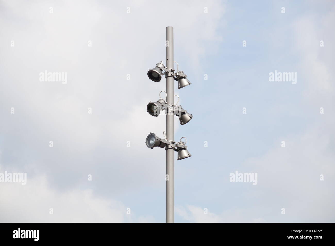 spotlight tower against blue sky. street lamp. modern light pole. Stock Photo