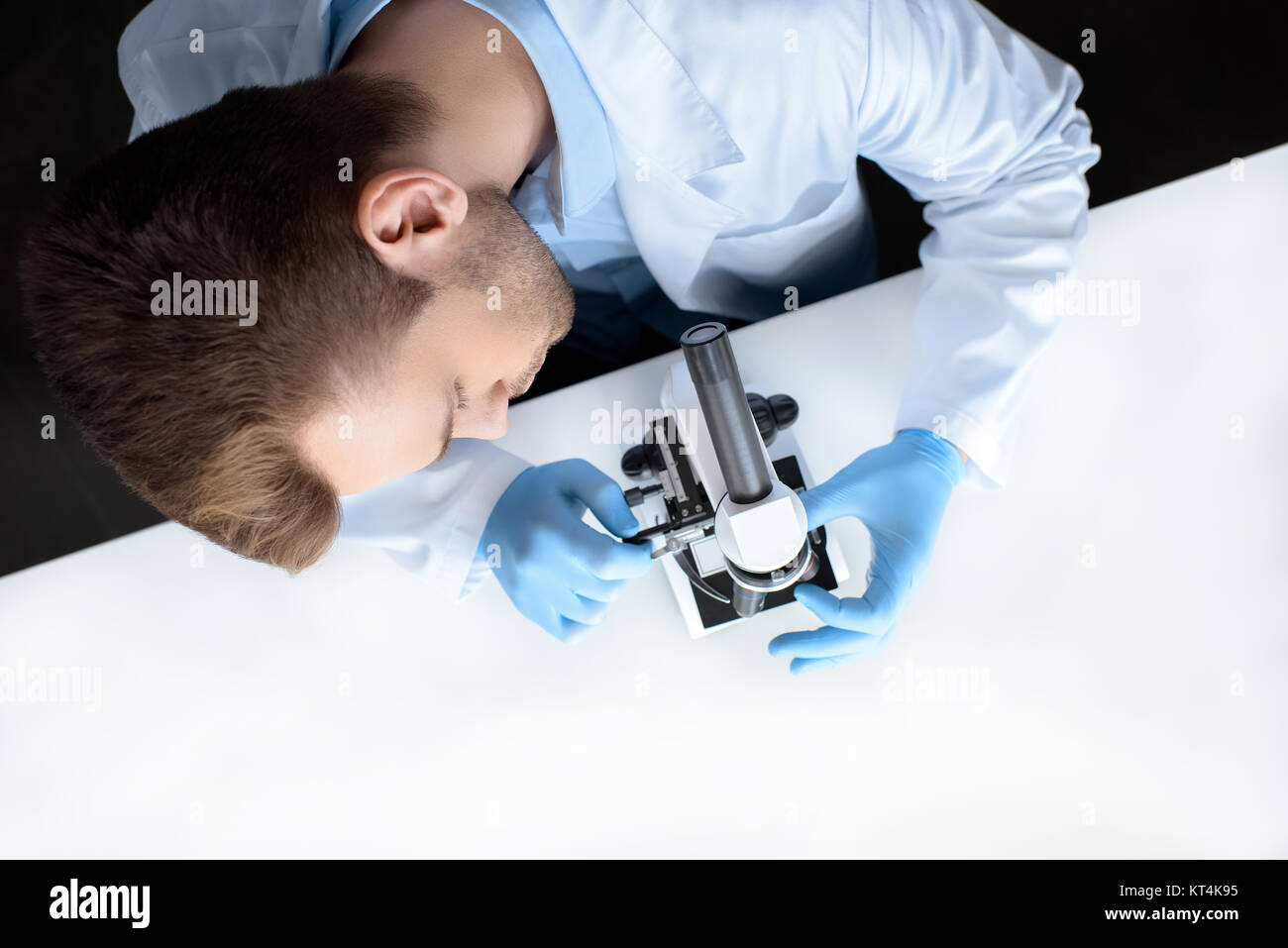 Lab Microscope Top View top view of scientist working with microscope in laboratory Stock Photo ...