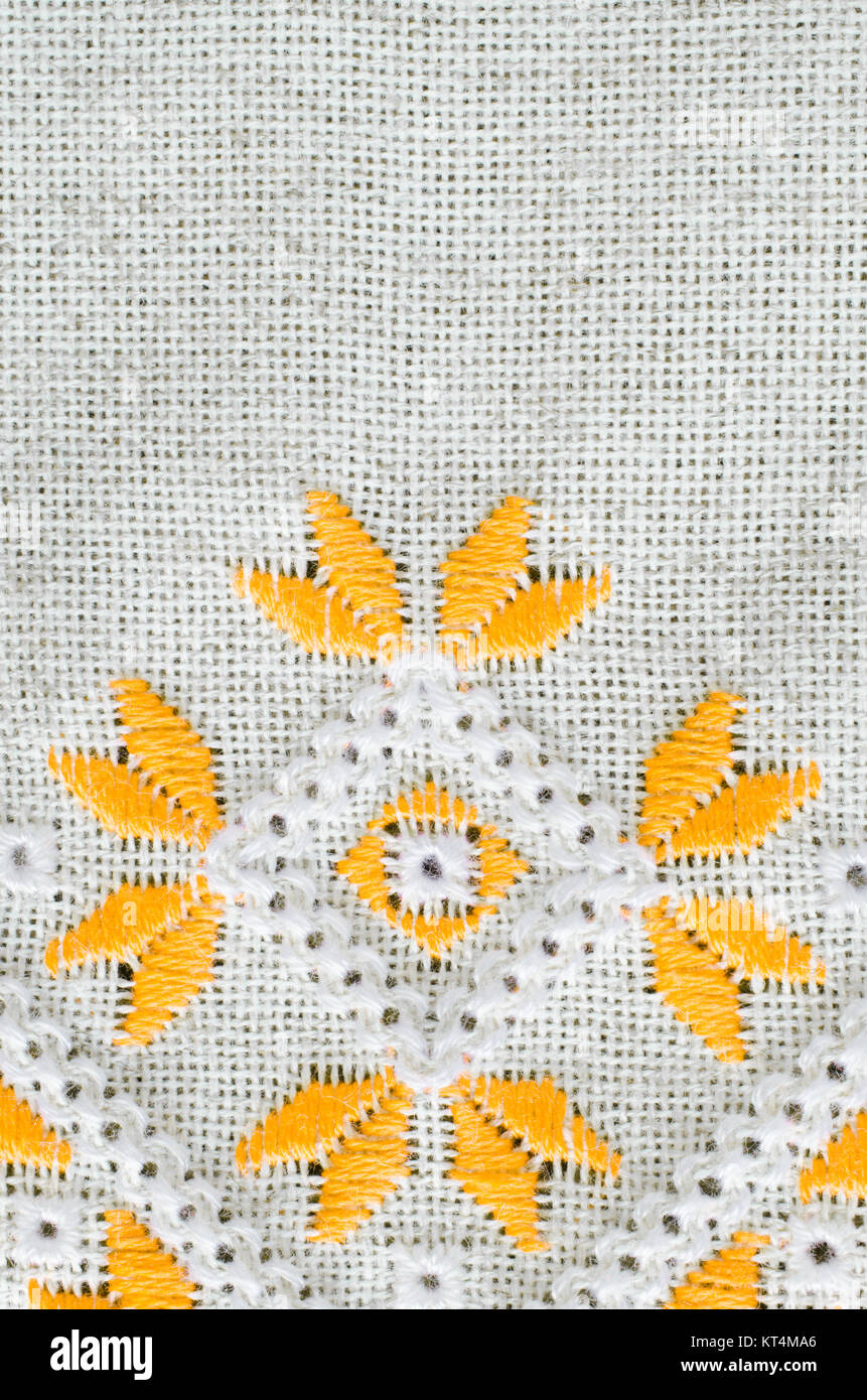 Embroidery by yellow cotton threads on flax Stock Photo Alamy
