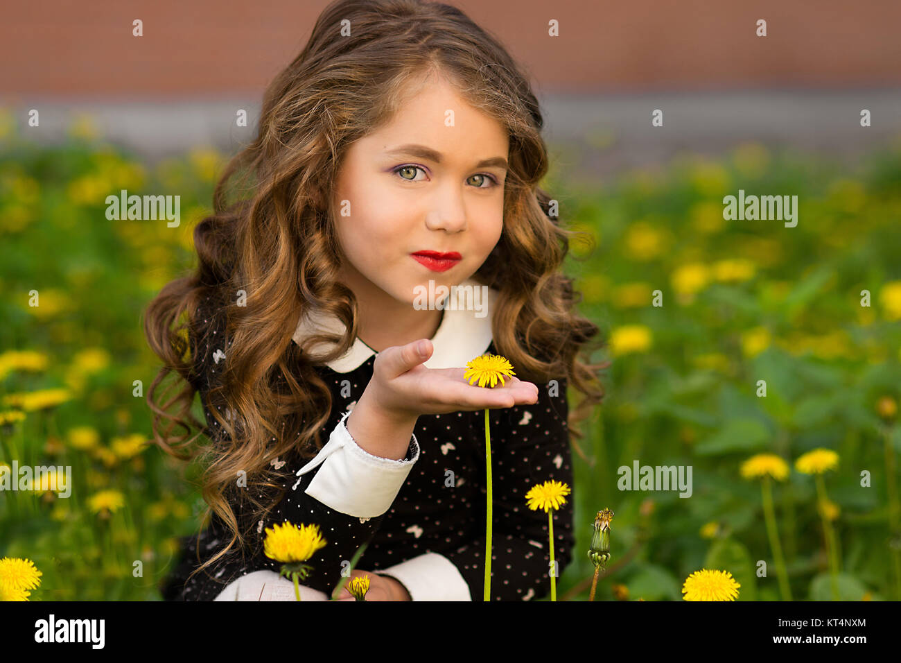 Sunny Closeup Portrait Of Pretty Little Girl With Yellow Dandeloin