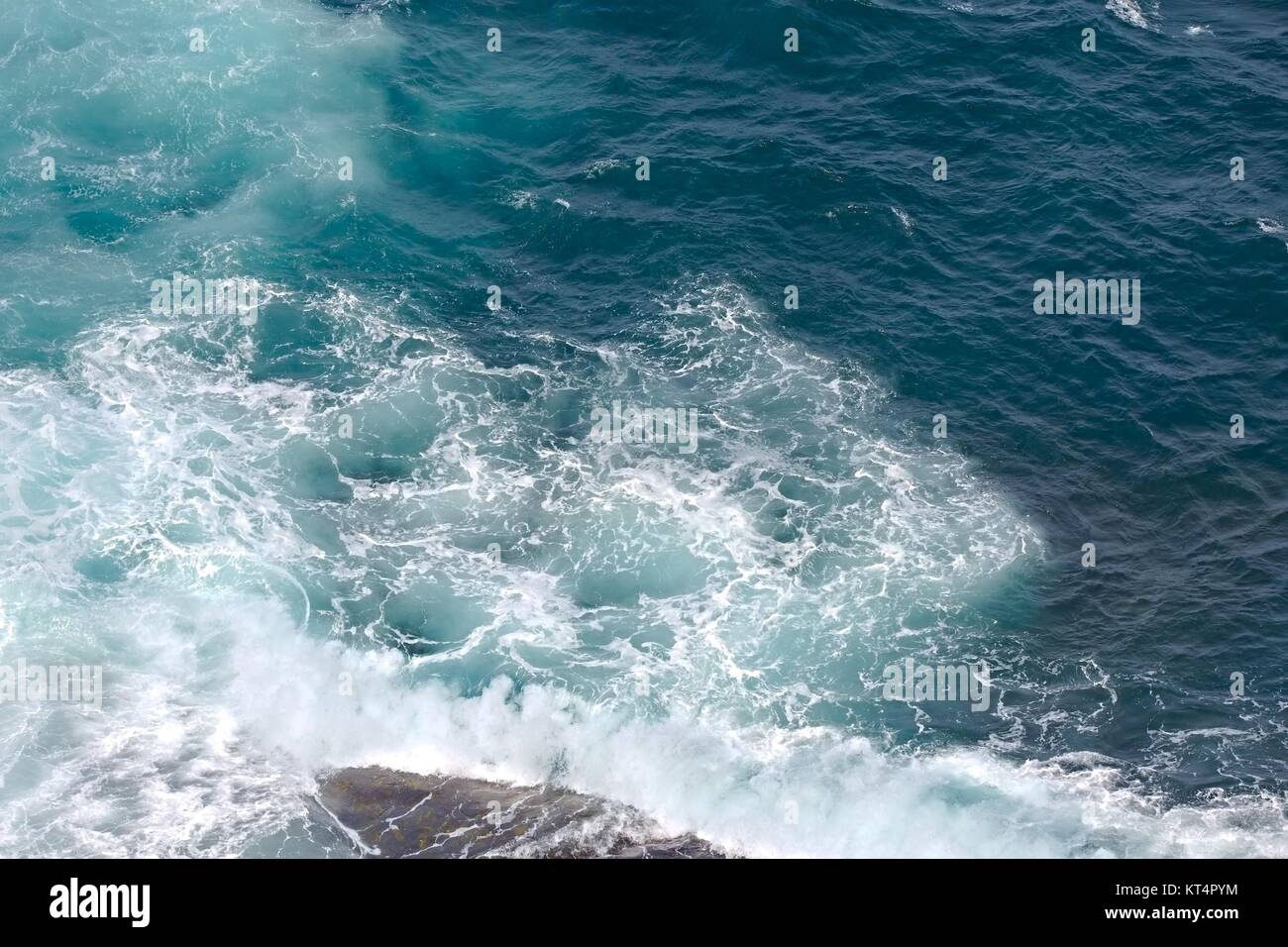 Waves hitting shore Stock Photo - Alamy