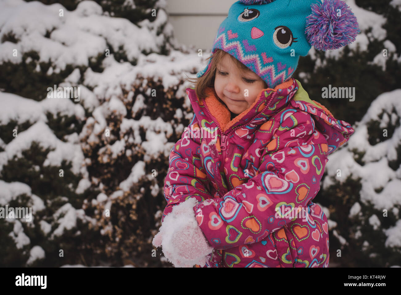Little girl wearing pink coat hi-res stock photography and images - Alamy