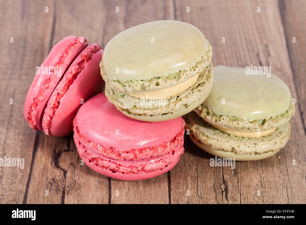 Colorful cookies of macaroon isolated on wooden plank Stock Photo