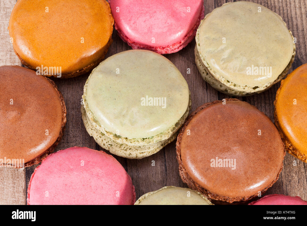 Colorful cookies of macaroon isolated on wooden plank Stock Photo