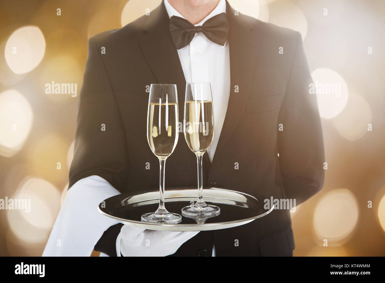 Waiter Serving Glass Of Champagne Stock Photo Alamy