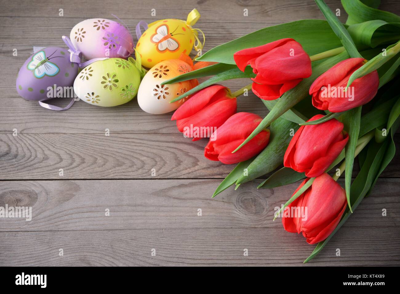 Easter eggs in nest with tulips Stock Photo - Alamy