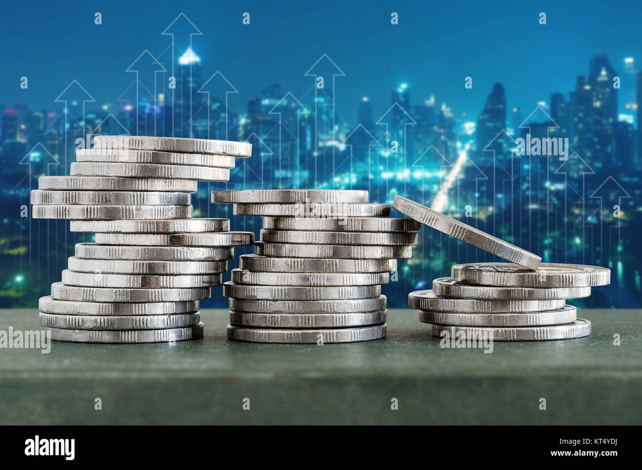 Coin stacks with finance growth up and cityscape background Stock Photo ...