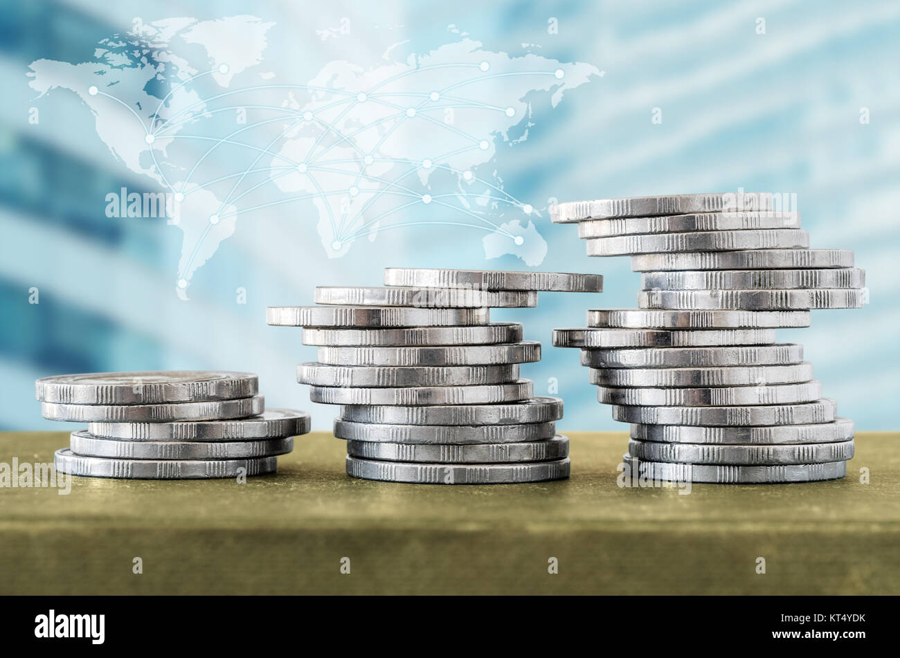 Coin stacks and digital network line with world map, cityscape ...
