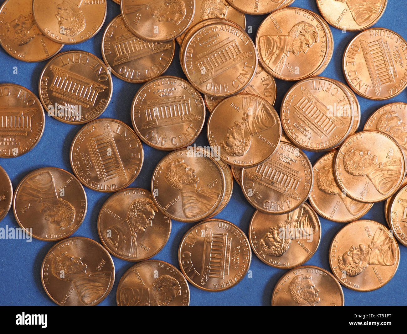 One Cent Dollar coins, United States over blue Stock Photo - Alamy