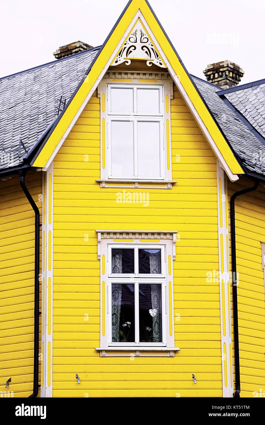 yellow wood house front two windows Stock Photo Alamy