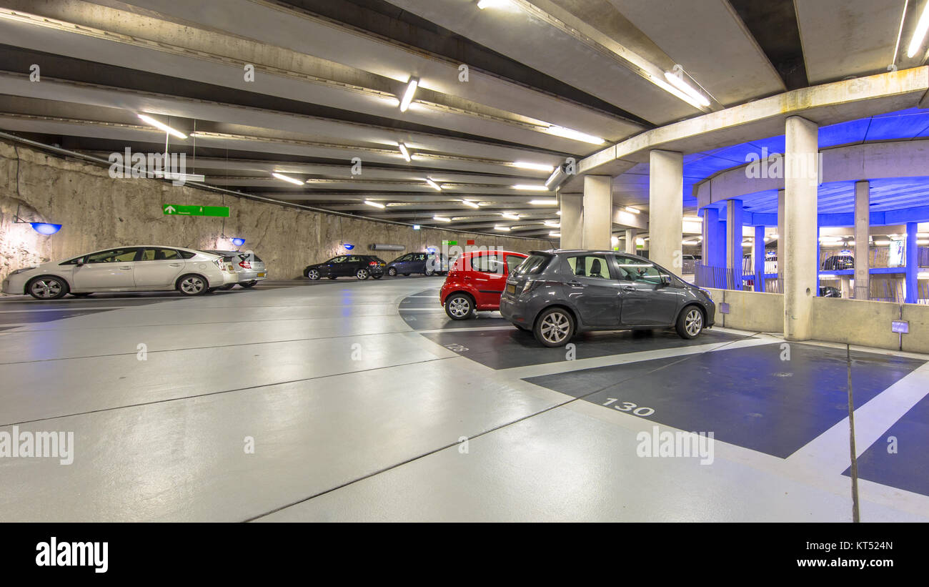 Cars in Modern Underground circular parking garage Stock Photo