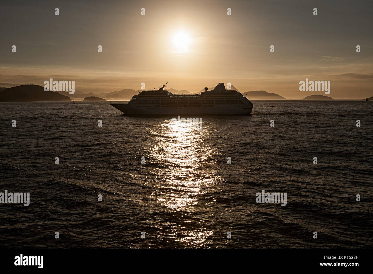 Cruise ship at sunset Stock Photo - Alamy