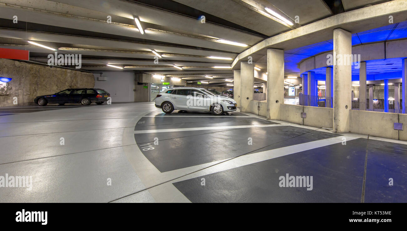 Modern Underground circular parking garage with parked cars Stock Photo