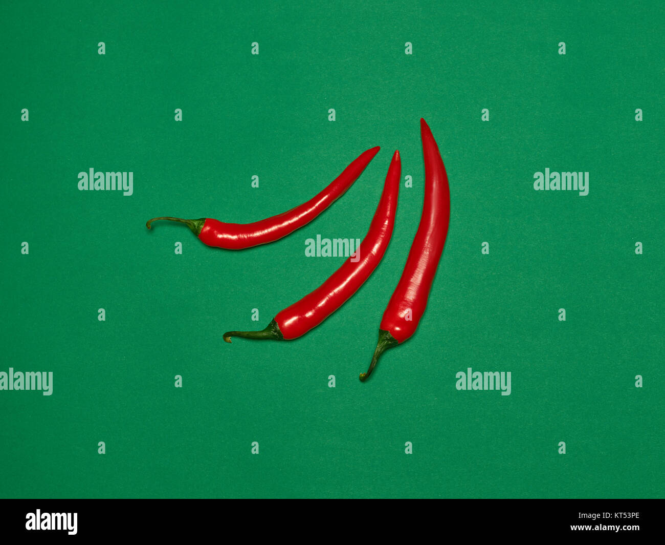 bitter chili pepper and paprika on a green background Stock Photo Alamy