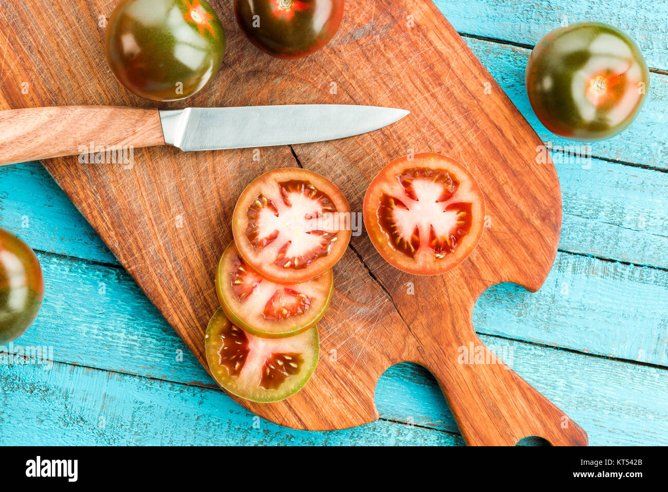 fresh tomatoes on board Stock Photo - Alamy