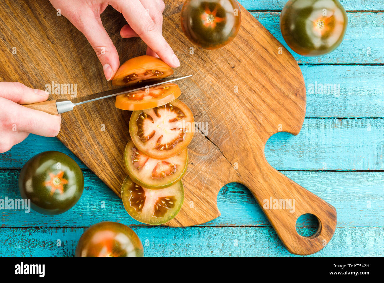 fresh tomatoes on board Stock Photo - Alamy