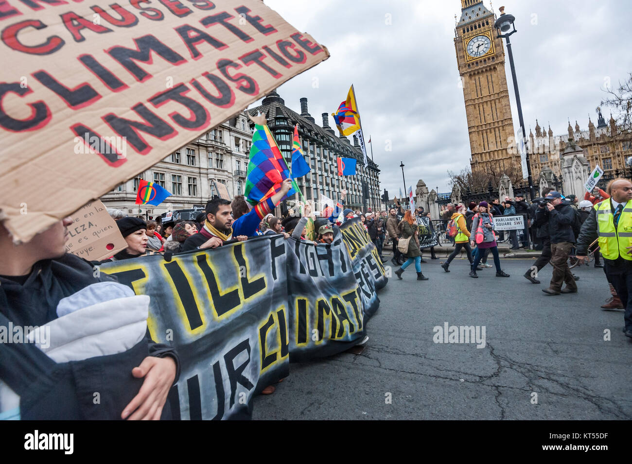 The Global Frontline bloc marches into Parliament Square and past Big Ben on the People's March for Climate & Jobs in London. Stock Photo