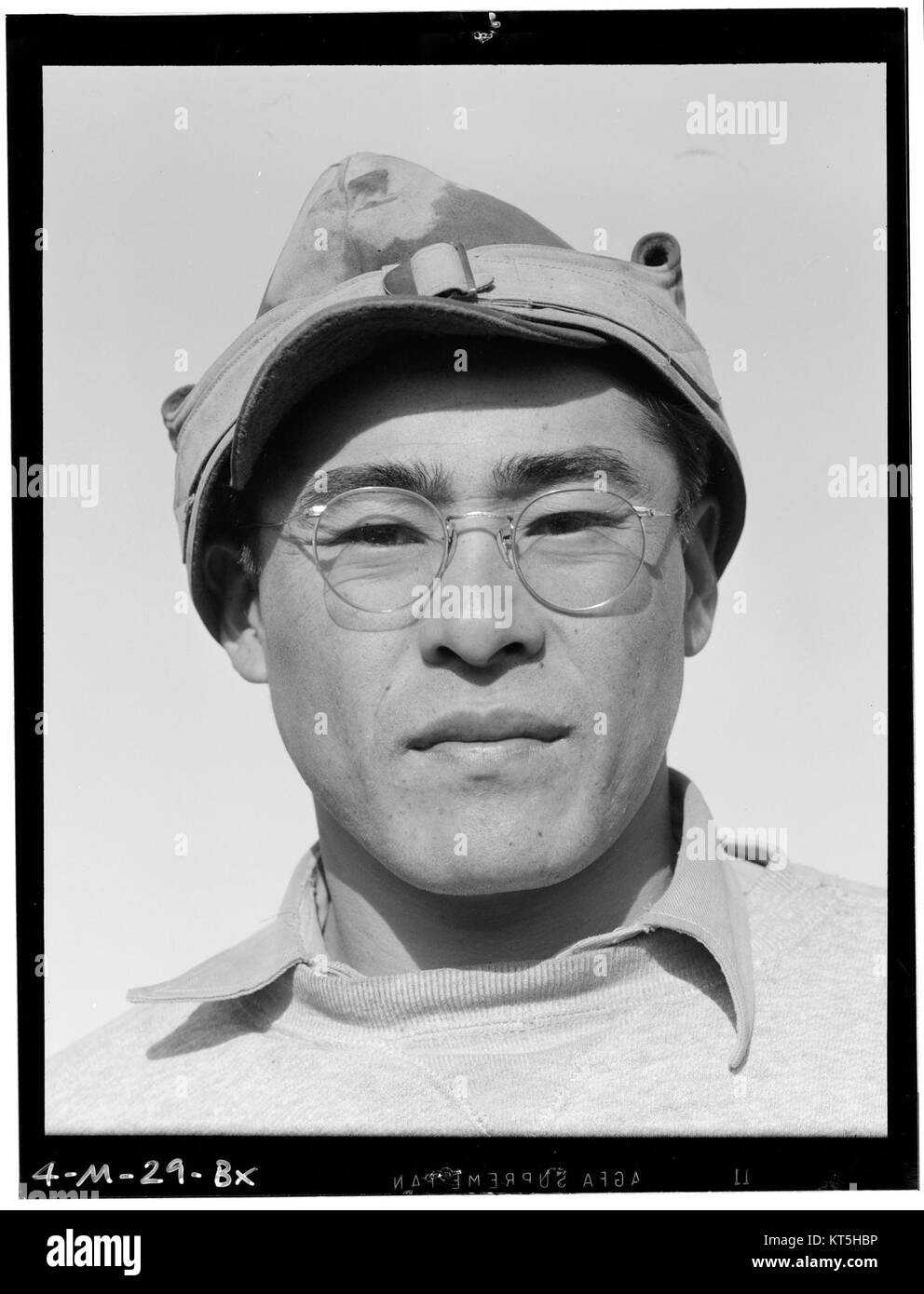 This photograph, part of Ansel Adams’ Manzanar series, features Ryobe Nojima, a farmer who was relocated during World War II. The image captures a poignant moment of his life in the Manzanar internment camp. Stock Photo