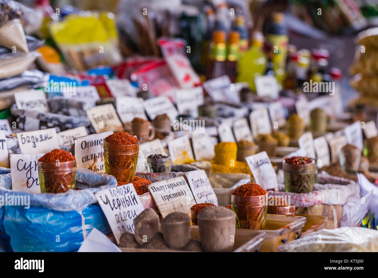 Beautiful vivid oriental market with bags full of various spices in Osh bazaar in Bishkek, Kyrgyzstan. Stock Photo