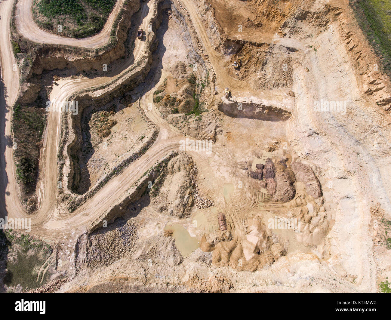 Mining quarry with special equipment, open pit excavation. Sand mine. View from above. Stock Photo