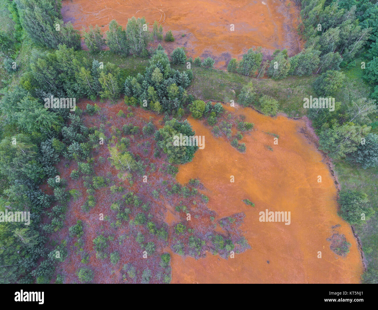 Old sulfuric acid natural tank orange color in south of Poland Stock Photo Alamy