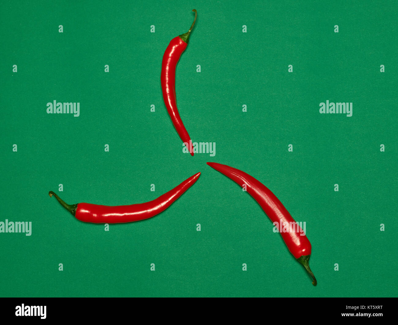 bitter chili pepper and paprika on a green background Stock Photo Alamy