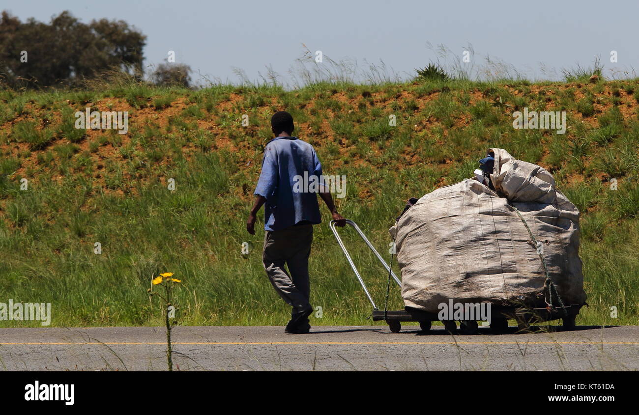 Johannesburg, South Africa unidentified man carts plastic collected