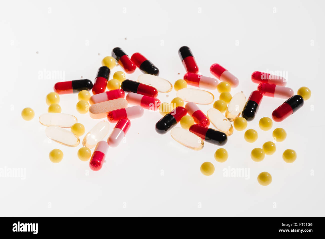 Pile of colorful medical pills on white, medicine and healthcare