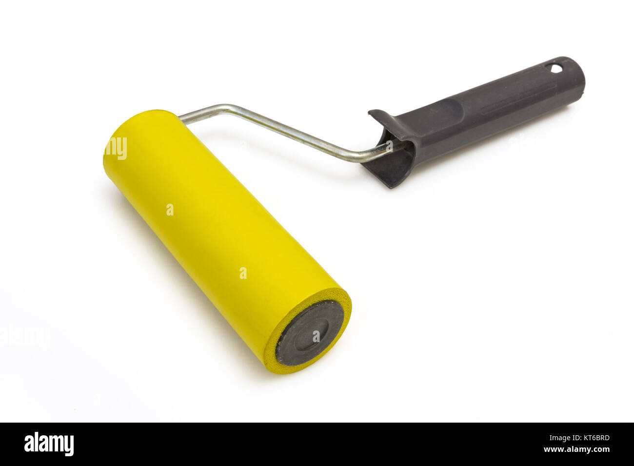 Yellow rubber paint roller on a white background Stock Photo Alamy