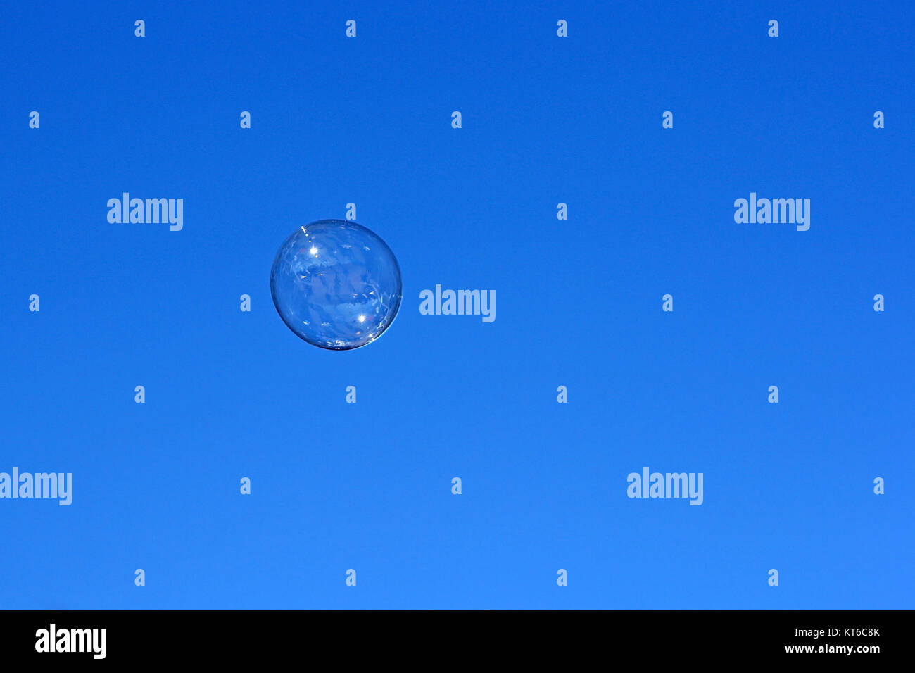 Soap bubble flying against the blue sky Stock Photo - Alamy