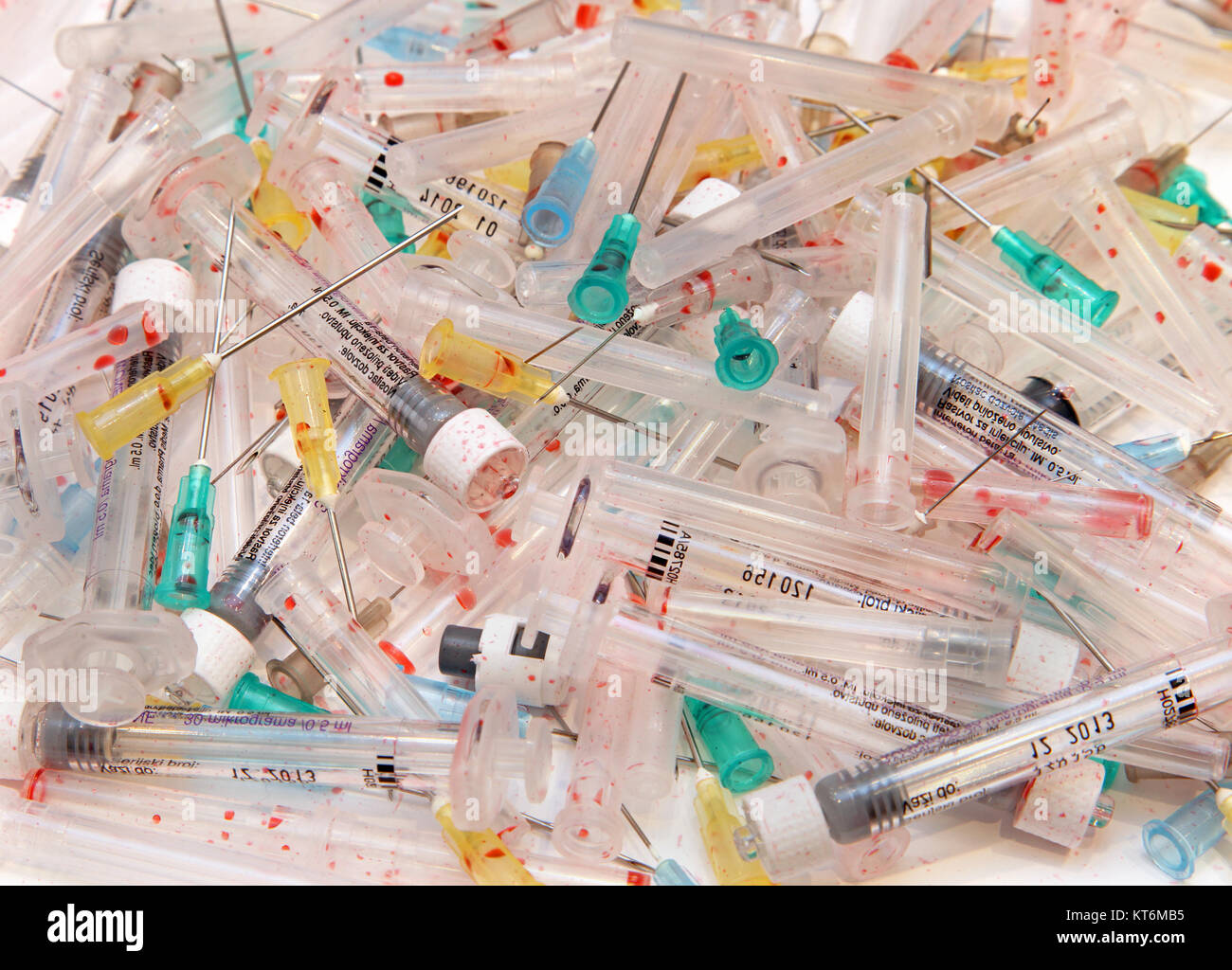 Bunch of used needles and syringes with human blood Stock Photo Alamy