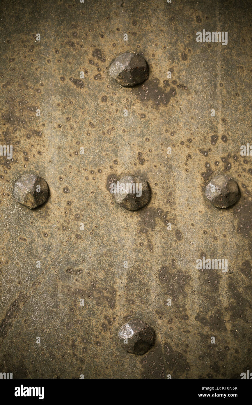 Armour Rivets Brown grunge metal plate or armour texture with rivets as background ...