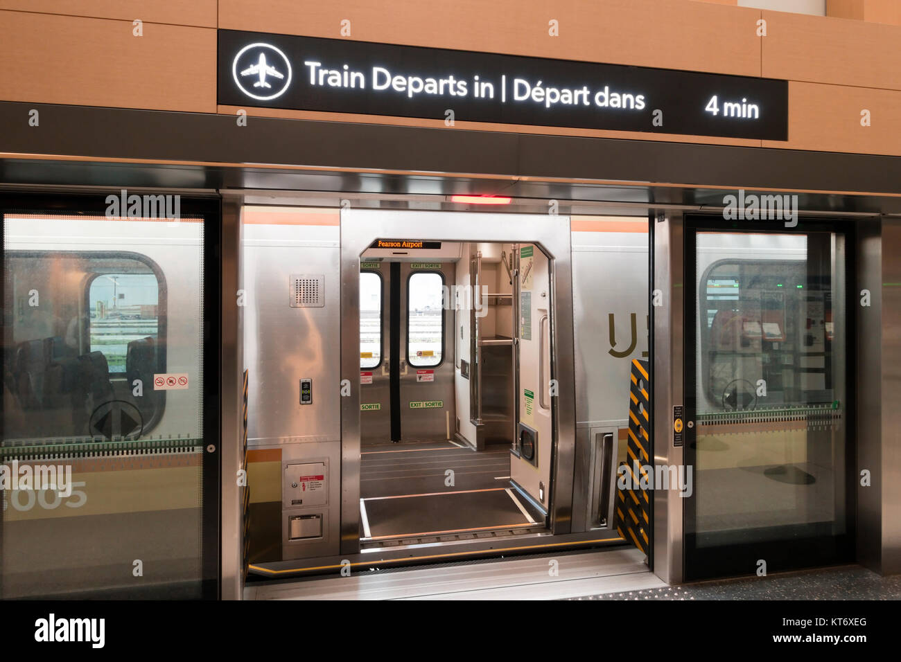 Standing on the platform looking inside the UP Express or Union Pearson Express train at Union Station in Toronto, Ontario, Canada. Stock Photo