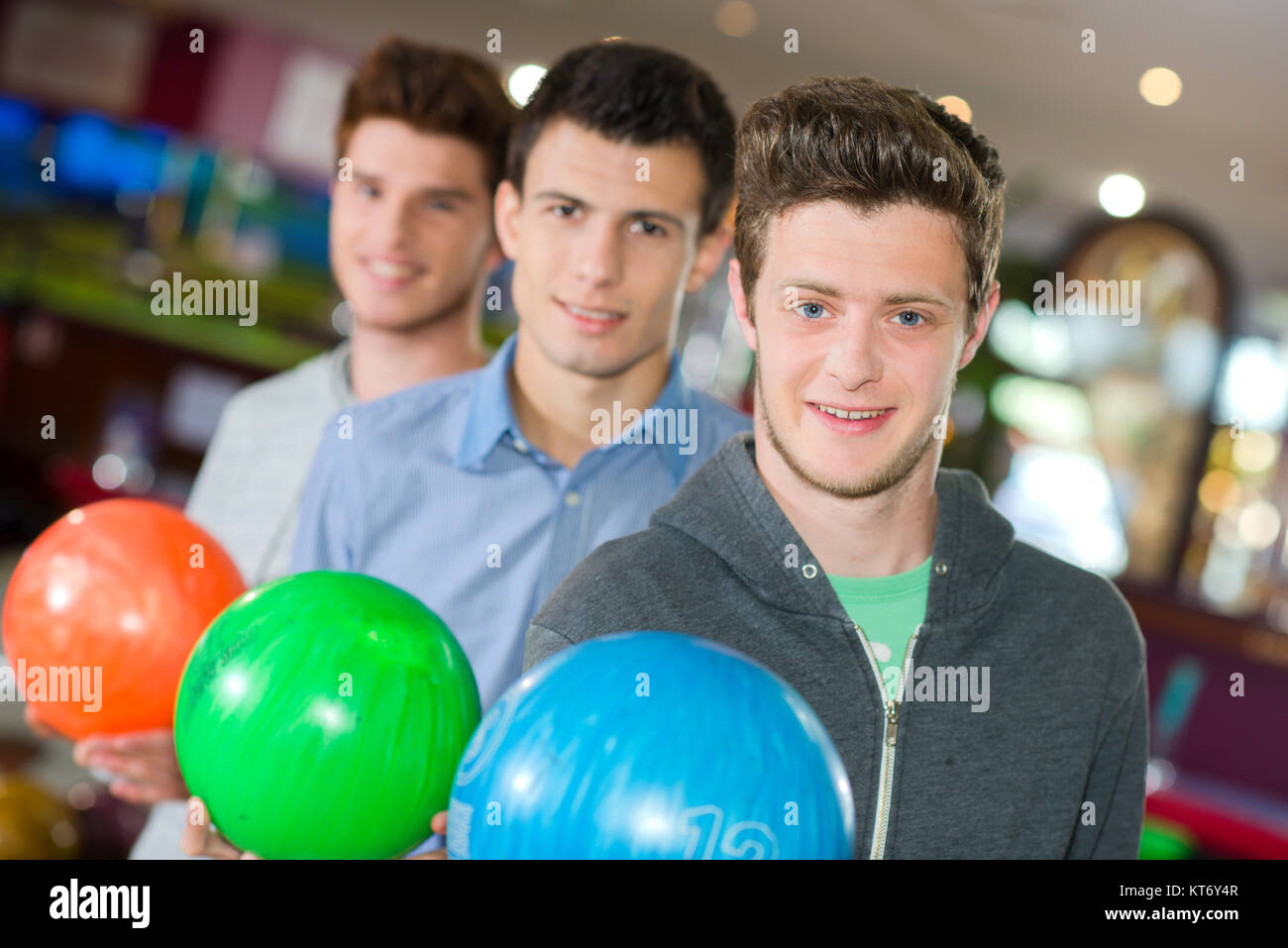 men holding bowling balls Stock Photo Alamy
