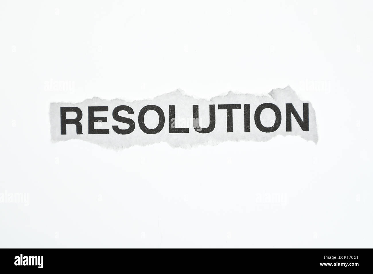The word Resolution on torn paper Stock Photo
