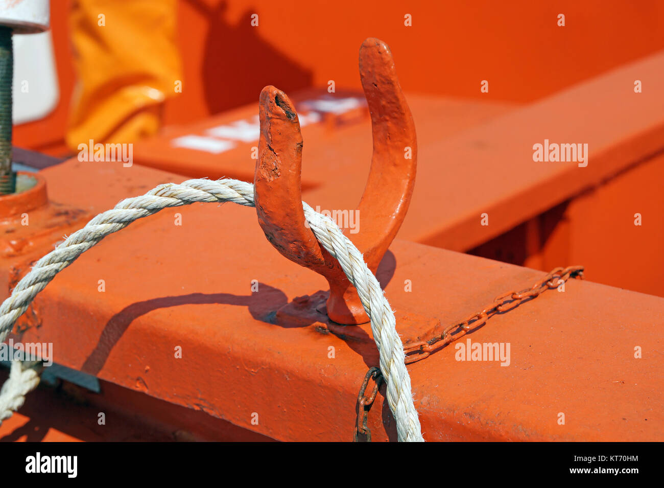 Detailed view of rope, nautical equipment with red boat background