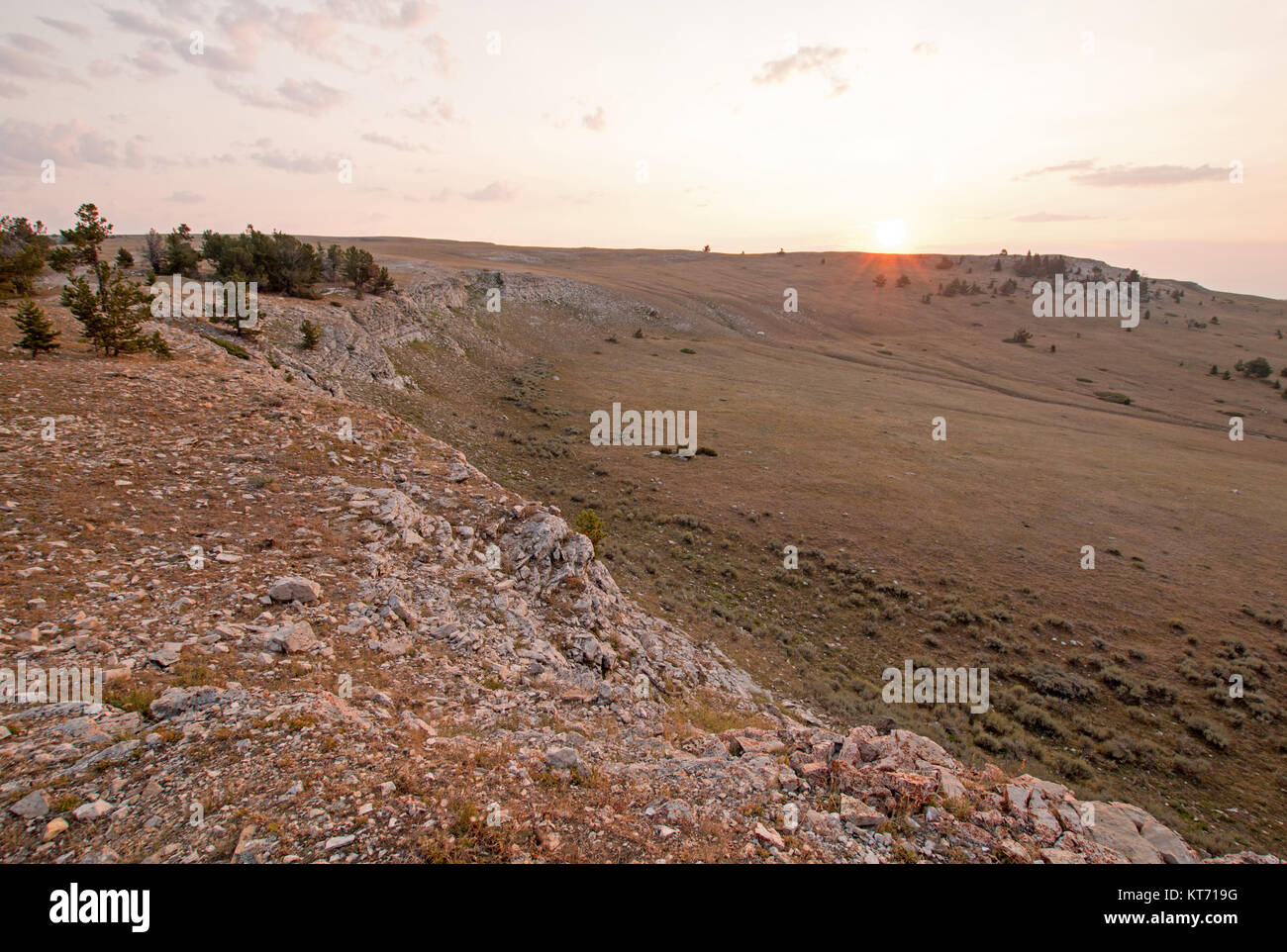 Sunrise on ridge over Teacup Canyon / Bowl on Sykes Ridge in the Pryor Mountains on the Wyoming Montana state line - United States Stock Photo