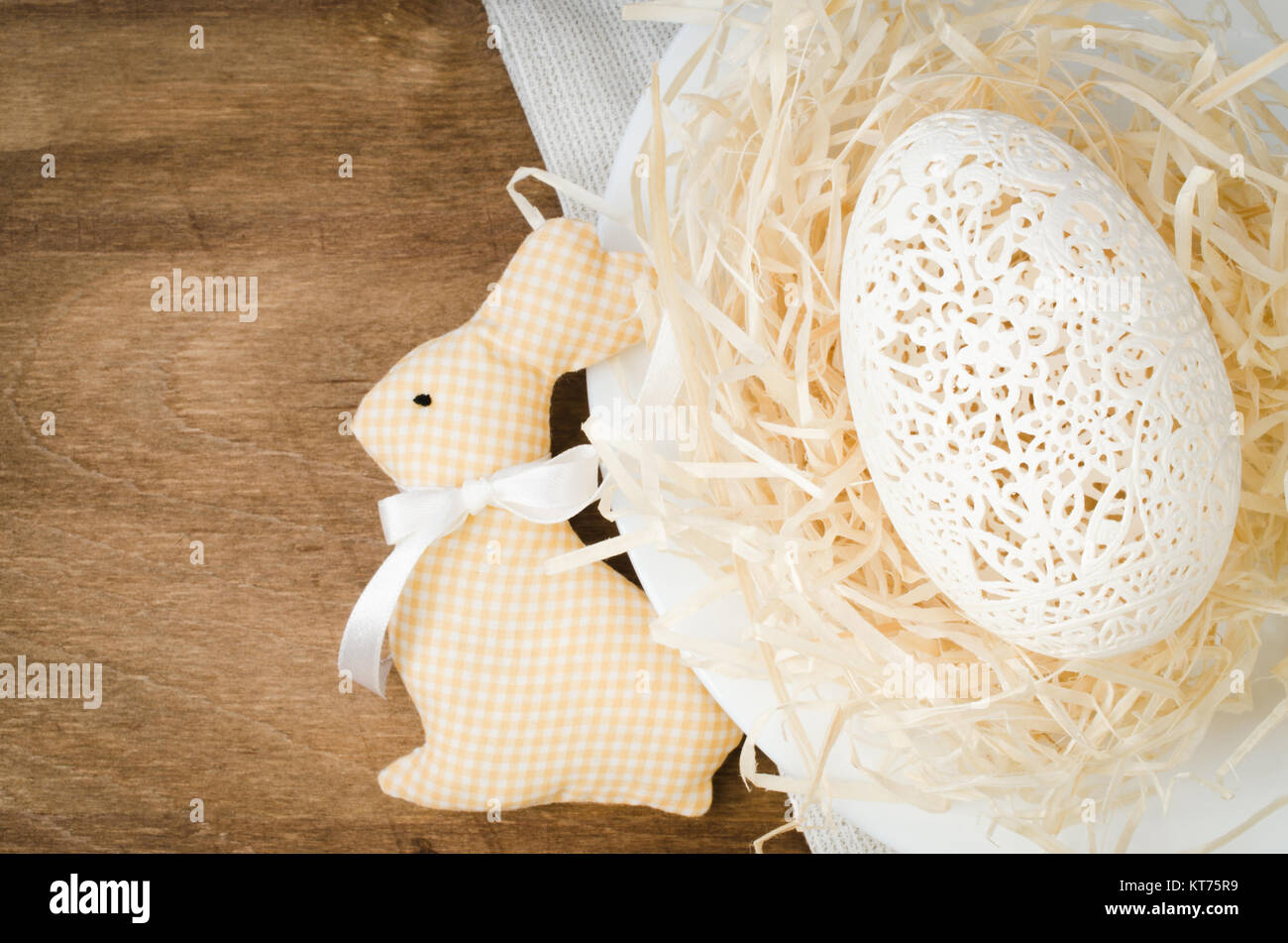 Table Setting for Easter Celebration. Carved Egg. Stock Photo