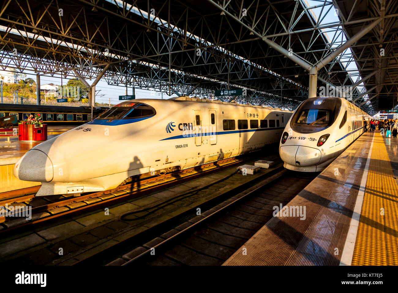 Two types of bullet trains at Yichang East Railway Station the CRH2A at left and the CRH5 Stock Photo