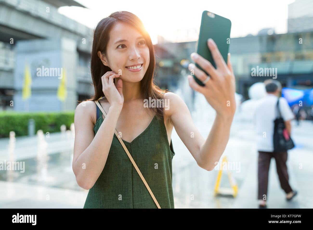 Woman taking selfie by cellphone at outdoor Stock Photo - Alamy