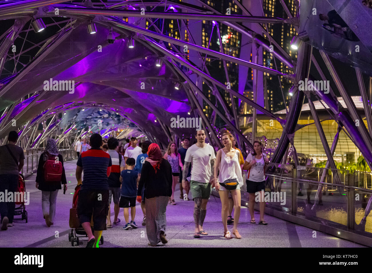 Singapore Asia October 28, 2017 People walking on the Helix Bridge at night Stock Photo