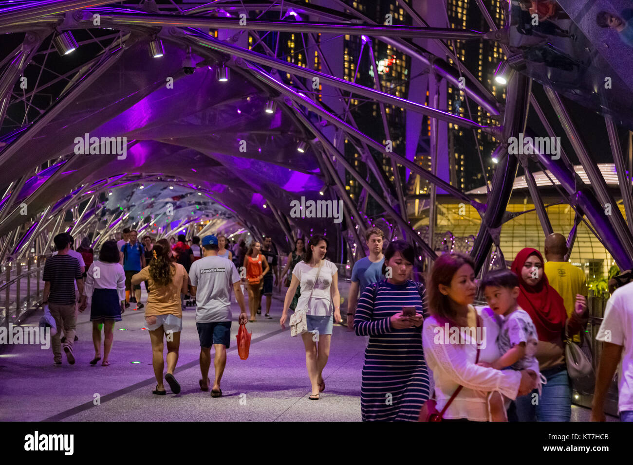 Singapore Asia October 28, 2017 People walking on the Helix Bridge at night Stock Photo