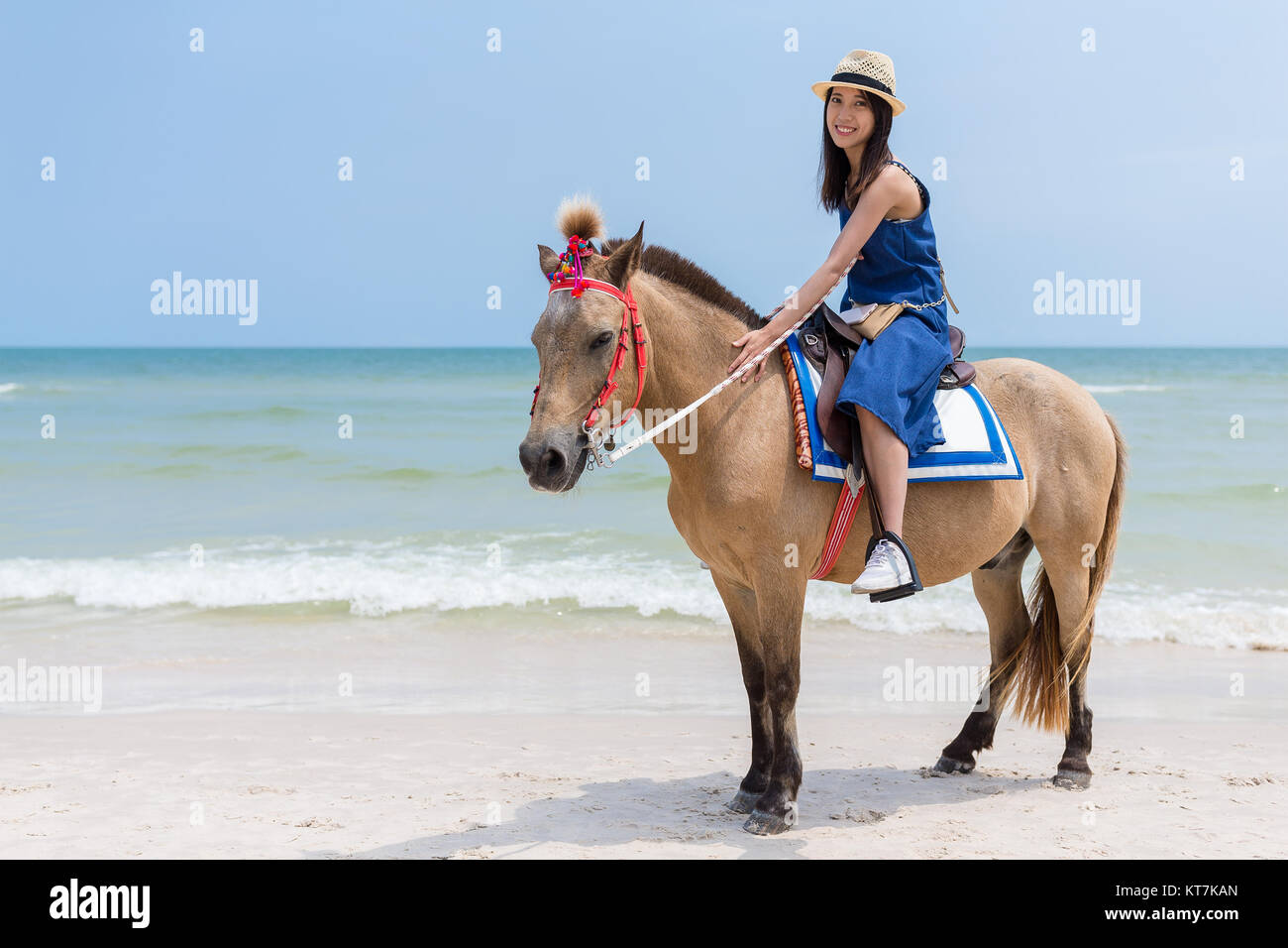 Beautiful Woman riding horse in sand beach Stock Photo - Alamy