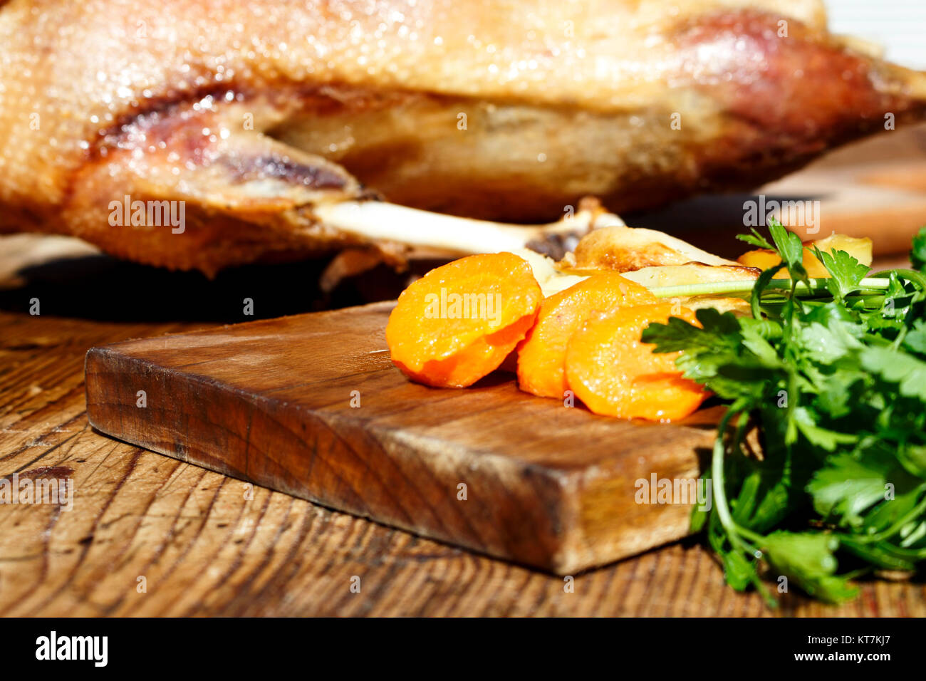 Roasted goose on wooden table Stock Photo