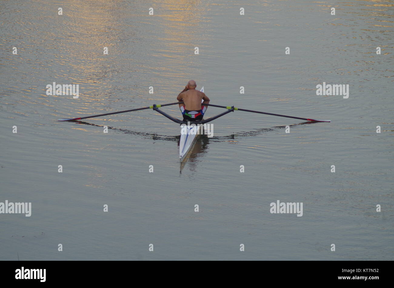 man that answer the cell phone while kayaking Stock Photo