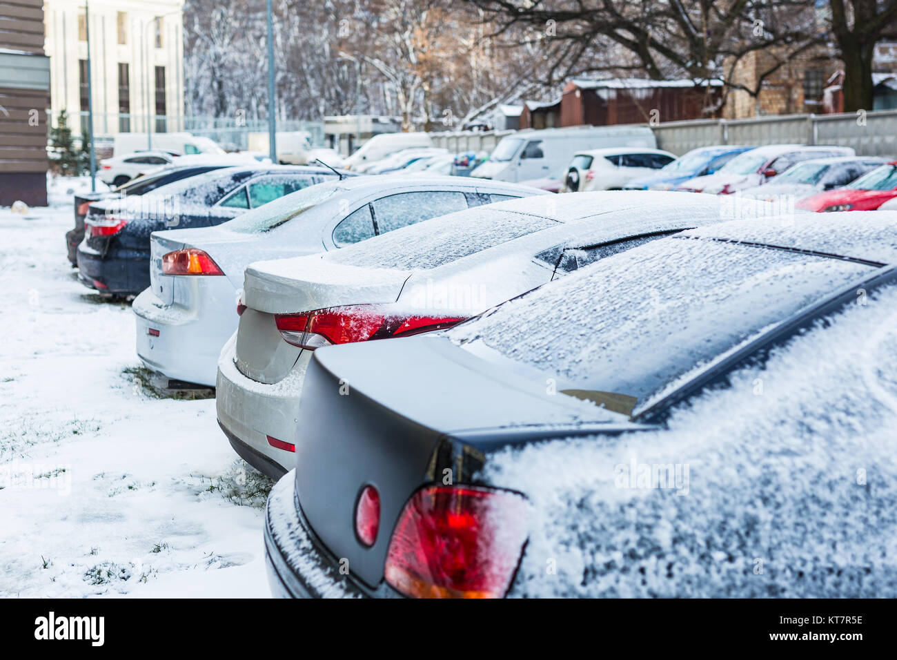 Parking of cars covered with snow on a city street Stock Photo - Alamy