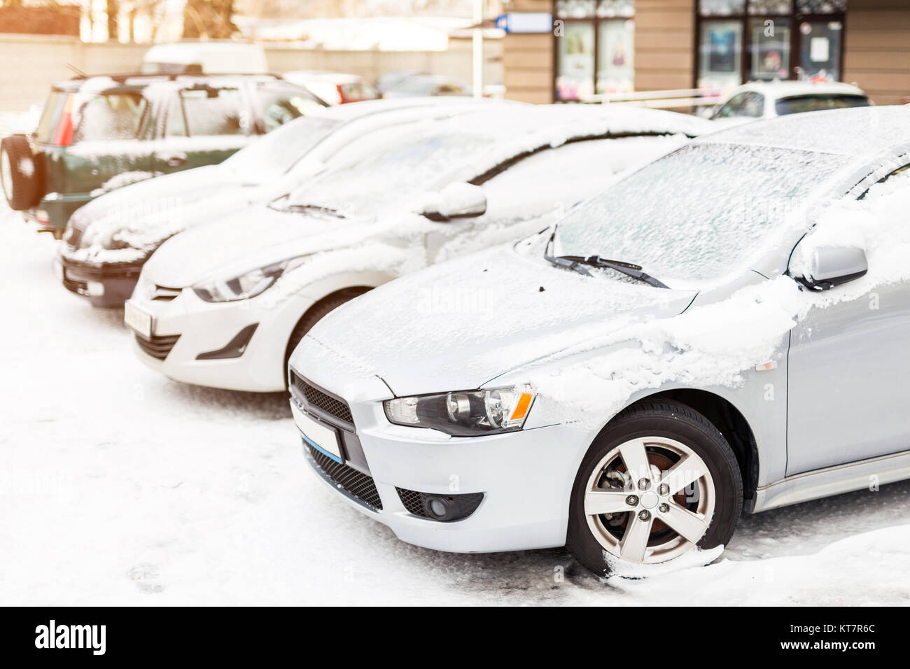 Parking of cars covered with snow on a city street Stock Photo - Alamy