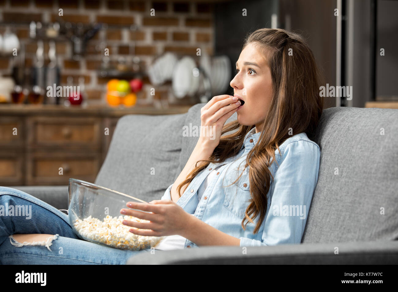 Girl eating popcorn Stock Photo Alamy